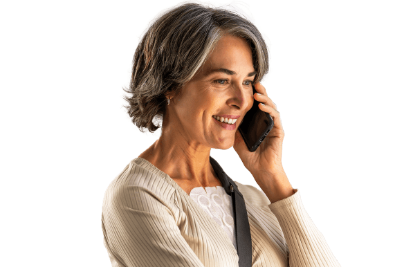 Woman wearing Optune Lua transducer arrays on her chest talks on her cellphone.